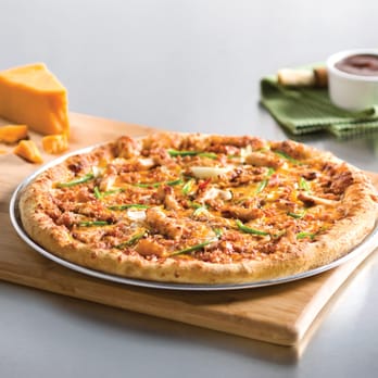 Domino's Pizza - a pizza on a cutting board - Pizza Near Me - Prince Albert, Saskatchewan Domino's Pizza - a pizza on a cutting board - Pizza Near Me - Prince Albert, Saskatchewan