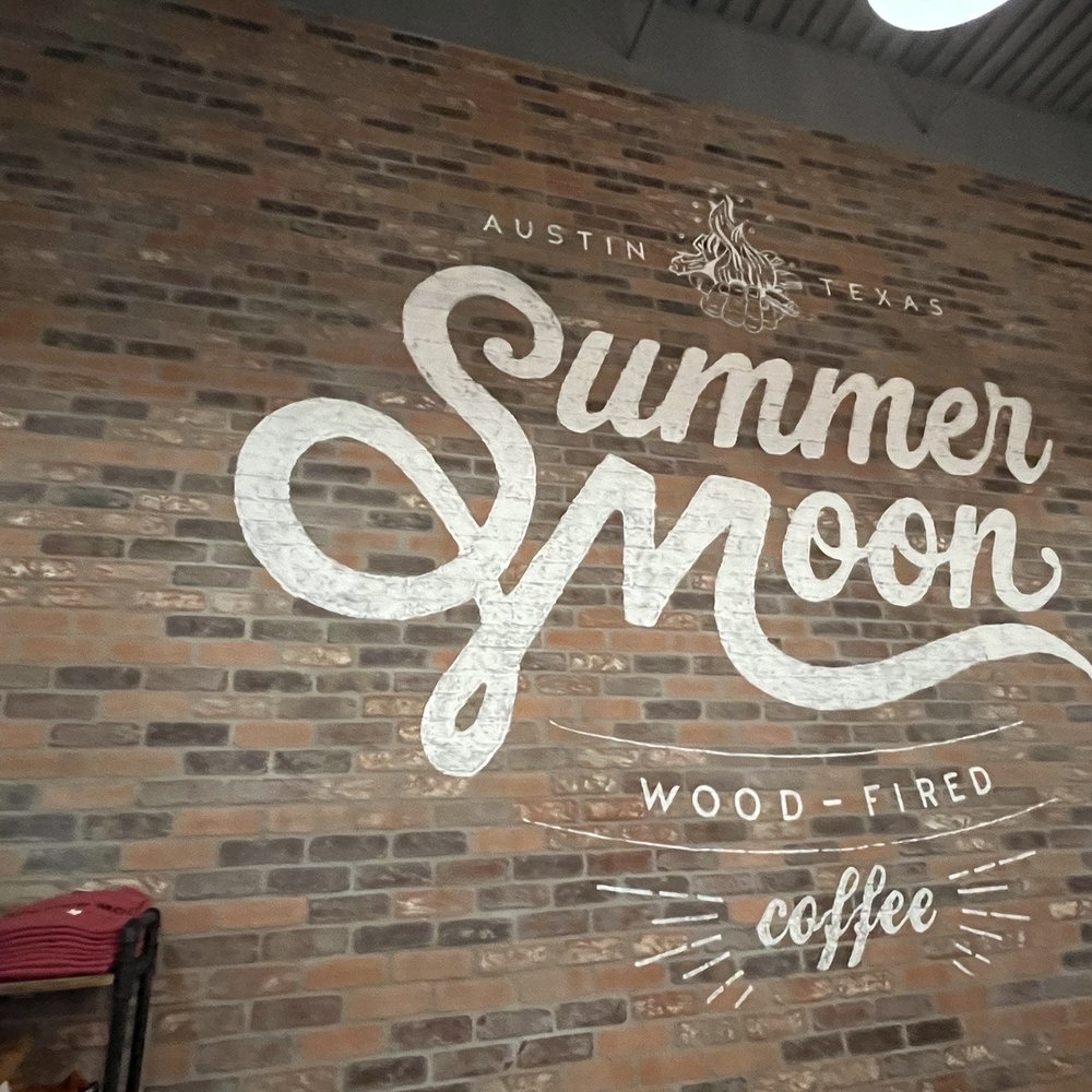 Summer Moon Coffee - a brick wall with a sign on it - Coffee Roasteries Near Me - Austin, Texas Summer Moon Coffee - a brick wall with a sign on it - Coffee Roasteries Near Me - Austin, Texas