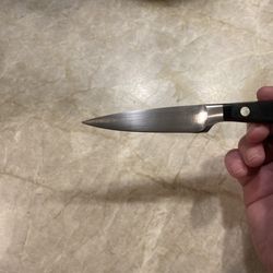 Eversharp - Wusthof label has been sharpened off. Not sure why the sharpening apparatus was applied to that part of the blade.