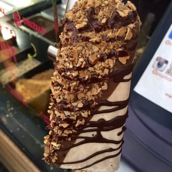 Popbar - My delicious creation: hazelnut bar half dipped in milk choco, hazelnuts, waffle cone bits, & drizzled in mint dark choco - Desserts Near Me - Anaheim, California