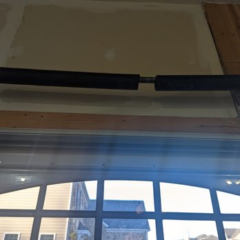 Daystar Doors - Before: Broken single-spring on 2 bay door. - Garage Door Services Near Me Daystar Doors - Before: Broken single-spring on 2 bay door. - Garage Door Services Near Me