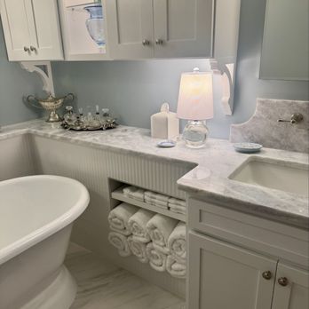 Bellagio Granite & Marble - Shadowstorm Quartzite counter that wraps around freestanding tub for function and beauty. - Countertop Installation Near Me - Gallatin, Tennessee Bellagio Granite & Marble - Shadowstorm Quartzite counter that wraps around freestanding tub for function and beauty. - Countertop Installation Near Me - Gallatin, Tennessee