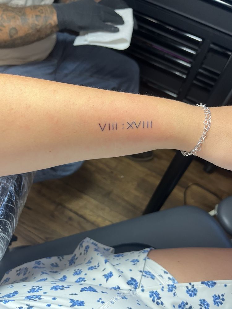 Port Orange Tattoo and Art Parlor Logo