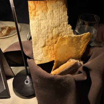 Opus 9 Steakhouse - Table bread with cracker like large pieces - Steakhouses Near Me - Williamsburg, Virginia Opus 9 Steakhouse - Table bread with cracker like large pieces - Steakhouses Near Me - Williamsburg, Virginia