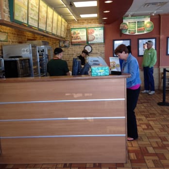 Subway - a woman standing at a counter in a restaurant - Sandwiches Near Me - Virginia Beach, Virginia