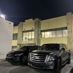 Envy GO Rentals - Night shot of our 2018 Infiniti QX60 and 2019 Cadillac Escalade ESV.