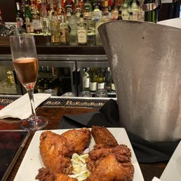 Raven wings with a bottle of Aria Raven wings with a bottle of Aria