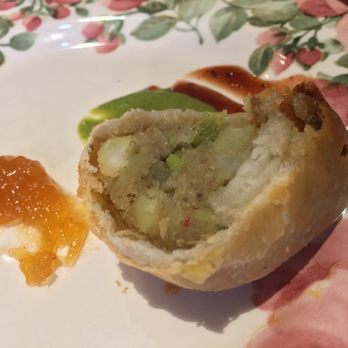 Cafe Lotus - Vegetable samosa cut in half. Stuffed wth potatoes and seasoning. Try the sauces with it too! - Indian Near Me - Fairfax, California Cafe Lotus - Vegetable samosa cut in half. Stuffed wth potatoes and seasoning. Try the sauces with it too! - Indian Near Me - Fairfax, California