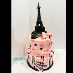 Cakes By Tiffany - Paris themed- 8" (3 layer) & 10" (3 layer) Smoothed buttercream cover. Fondant stripes/dots, bows.  Fondant and chocolate- Eiffel Tower