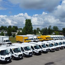 OnLine Auto - A Typical Lineup On The Lot. Lots of Cargo Vans And Cutaways. OnLine Auto Has Commercial Vehicles For Any Job!