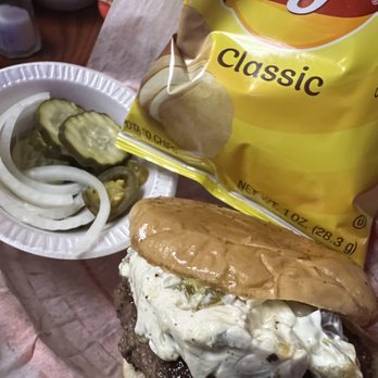 Candlelight Tavern - Jalapeño cream cheese burger with the side of chips, onions, pickles and jalapeños that come with. - Dive Bars Near Me - Denver, Colorado