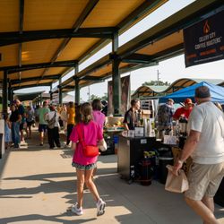 Portage Zhang Farmers Market - Customers and vendors in the Southwest Pavilion, view facing north.