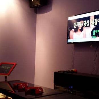 Midnight Karaoke - a flat screen tv in a living room - Karaoke Near Me - Ann Arbor, Michigan