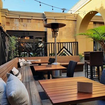 Wine Gallery - a patio with tables and chairs - Tapas/Small Plates Near Me - Laguna Beach, California Wine Gallery - a patio with tables and chairs - Tapas/Small Plates Near Me - Laguna Beach, California