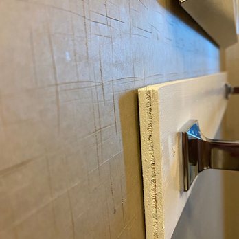 Hotel del Coronado, Curio Collection by Hilton - Towel rod attached to wall with cheap plywood that was not sealed and is now coming off the wall - Coronado, CA