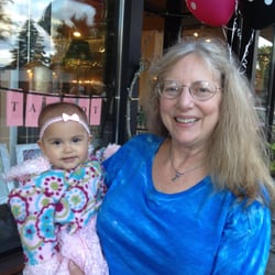 Coco Gets Dressed - My grand daughter and I in front of Coco's after a fashion show.
