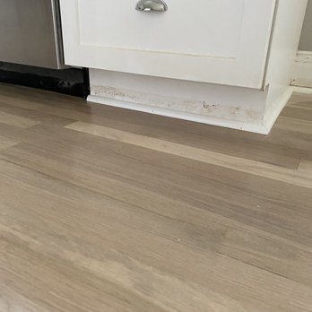 Simple Flooring - Stain left after job. Note: they did have painters come to fix cabinets. - Flooring Near Me - Elk Grove Village, Illinois