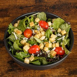 Gambinos Restaurant - Side salad with cruttons and cherry tomatoes.