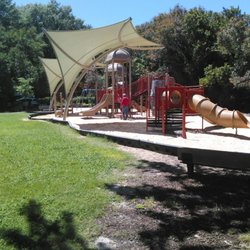 Age graduated playground on nice sand.