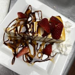 Big Es Bar And Grill - Classic cheesecake with caramel, chocolate and strawberries
