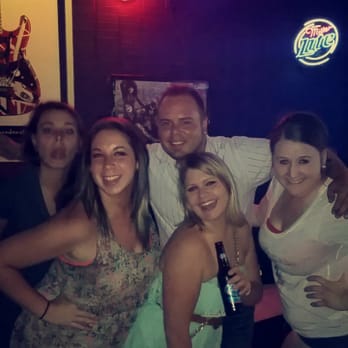 Guitars - a group of people posing for a picture - Bars Near Me - Joplin, Missouri