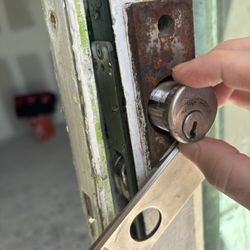 A&O Premium Locksmith - Medeco cylinder removed for rekeying to ensure full security for the new tenant.