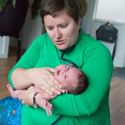 Coastal Maternity Care - Emily examining my newborn after we came home from the hospital.