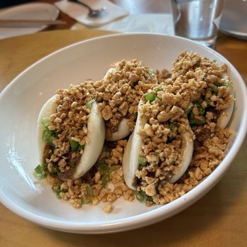 Win Son - Sloppy bao - Three steamed buns filled with ingredients, topped with chopped peanuts and green onions, served in a white bowl at a restaurant. - Taiwanese Near Me - Brooklyn, New York