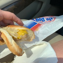 Kone Korner - The kraut dog with mustard. Barely warm and the hot dog looks unappetizingly pale.