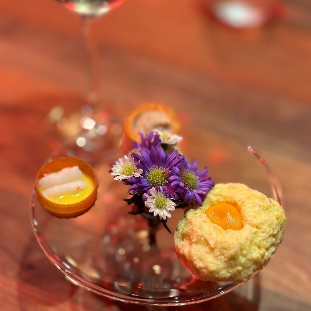 a glass of wine and a plate of food a glass of wine and a plate of food