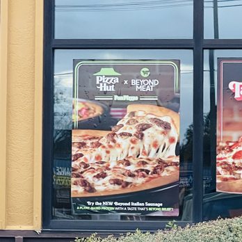 Pizza Hut - a sign in the window of a restaurant - Pizza Near Me - Angleton, Texas Pizza Hut - a sign in the window of a restaurant - Pizza Near Me - Angleton, Texas