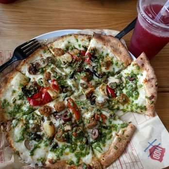 MOD Pizza - White sauce brussel sprouts chicken sausage Mediterranean olives and some pesto. Magnifique - Fast Food Near Me - Spring, Texas