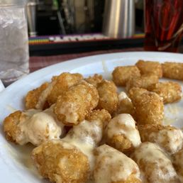 Tots! Not sure what is in the cheese sauce but SO GOOD Tots! Not sure what is in the cheese sauce but SO GOOD