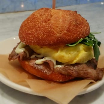 Dooby's - Steak and egg breakfast sandwich with horseradish aioli, served on a housemade bun. Scrumdiddlyumptious. - Coffee & Tea Near Me - Baltimore, Maryland