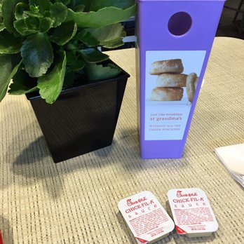 Chick-fil-A - Purple biscuits table marker and sauce holder. Nice that they had real potted plants for decoration - Fast Food Near Me - Pleasanton, California
