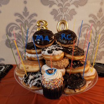 Alibi Speakeasy & Lounge - a display of donuts - Lounges Near Me - Farmingdale, New York