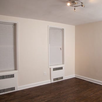 Arta Restoration - Bedroom- new paint job, blinds, sand and refinished floors to darker color - General Contractors Near Me - Queens, New York