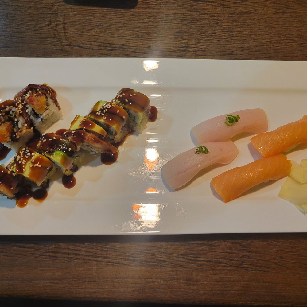 FuJi Sushi - Smoked salmon and Yellowtail sushi on the right. Both extremely fresh. On the left of the plate is the Fancy Dragon Roll, highly recommend. - Japanese Near Me - Midlothian, Virginia FuJi Sushi - Smoked salmon and Yellowtail sushi on the right. Both extremely fresh. On the left of the plate is the Fancy Dragon Roll, highly recommend. - Japanese Near Me - Midlothian, Virginia
