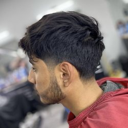 Culture Cutz - Taper fade with texture on top and beard line up by Victor. Call to schedule your next appt