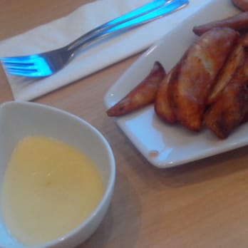 Cold Layers Cafe - Potato wedges and a mystery cream cheese dip that solidifies when left alone. - Coffee & Tea Near Me - Quezon City, NCR
