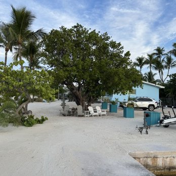 Coral Bay Resort - View from dock to the resort rooms and parking area - Hotels Near Me - Islamorada, Florida