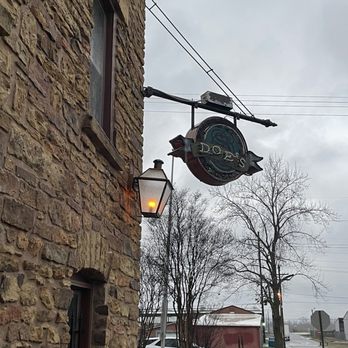 Doe's Eat Place - a brick building with a sign on it - Steakhouses Near Me - Fort Smith, Arkansas