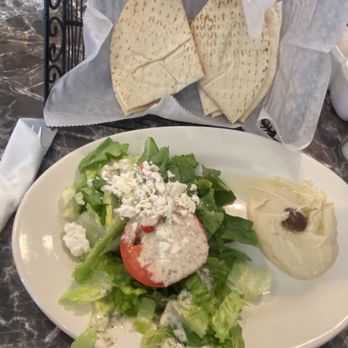 Petra Cafe - Greek salad with hummus and pita bread which came with the lunchtime Gyro plate. - American Near Me - Hattiesburg, Mississippi Petra Cafe - Greek salad with hummus and pita bread which came with the lunchtime Gyro plate. - American Near Me - Hattiesburg, Mississippi