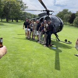 Heli  Chicago - Pre-jump photo with clients, next to the Heli Chicago OH-6A helicopter.