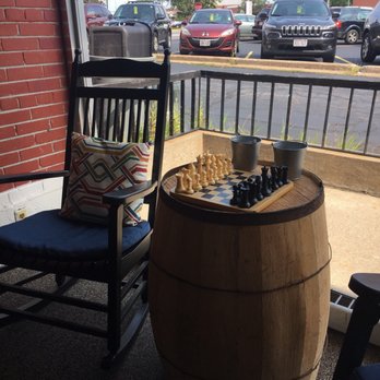 From the Ground Up Coffee House - a wooden barrel with chess pieces on it - Coffee & Tea Near Me - Wisc Rapids, Wisconsin