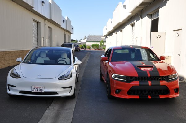 Photo of Immaculate Reflections Auto Detailing - Brentwood, CA, US. Tesla Model 3 and Dodge Charger Scat Pack going home to their owners after PPF and ceramic coating