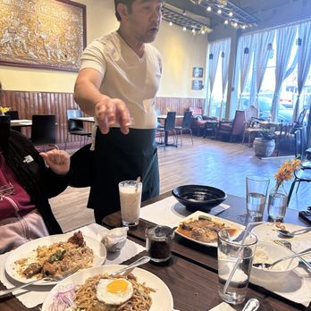 Burma Silver Star - 12. Pan Tay Noodle and the chef/owner explaining this particular specialty and how to mix the different components of the noodles together. - Burmese Near Me - Daly City, California Burma Silver Star - 12. Pan Tay Noodle and the chef/owner explaining this particular specialty and how to mix the different components of the noodles together. - Burmese Near Me - Daly City, California