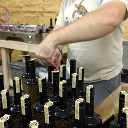Derelict Airship Distillery - Our distiller, putting the final touch on the first round of bottles, June 2017.