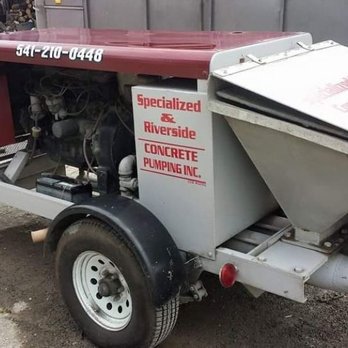 Specialized Concrete Pumping - a truck with a concrete pump attached to it - General Contractors Near Me Specialized Concrete Pumping - a truck with a concrete pump attached to it - General Contractors Near Me