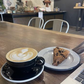 Pursue Coffee - I am horrible, I was so into the blueberry scone that I forgot what drink this is. But I think it is a flat white. Everything is delicious! - Coffee & Tea Near Me - Redondo Beach, California Pursue Coffee - I am horrible, I was so into the blueberry scone that I forgot what drink this is. But I think it is a flat white. Everything is delicious! - Coffee & Tea Near Me - Redondo Beach, California